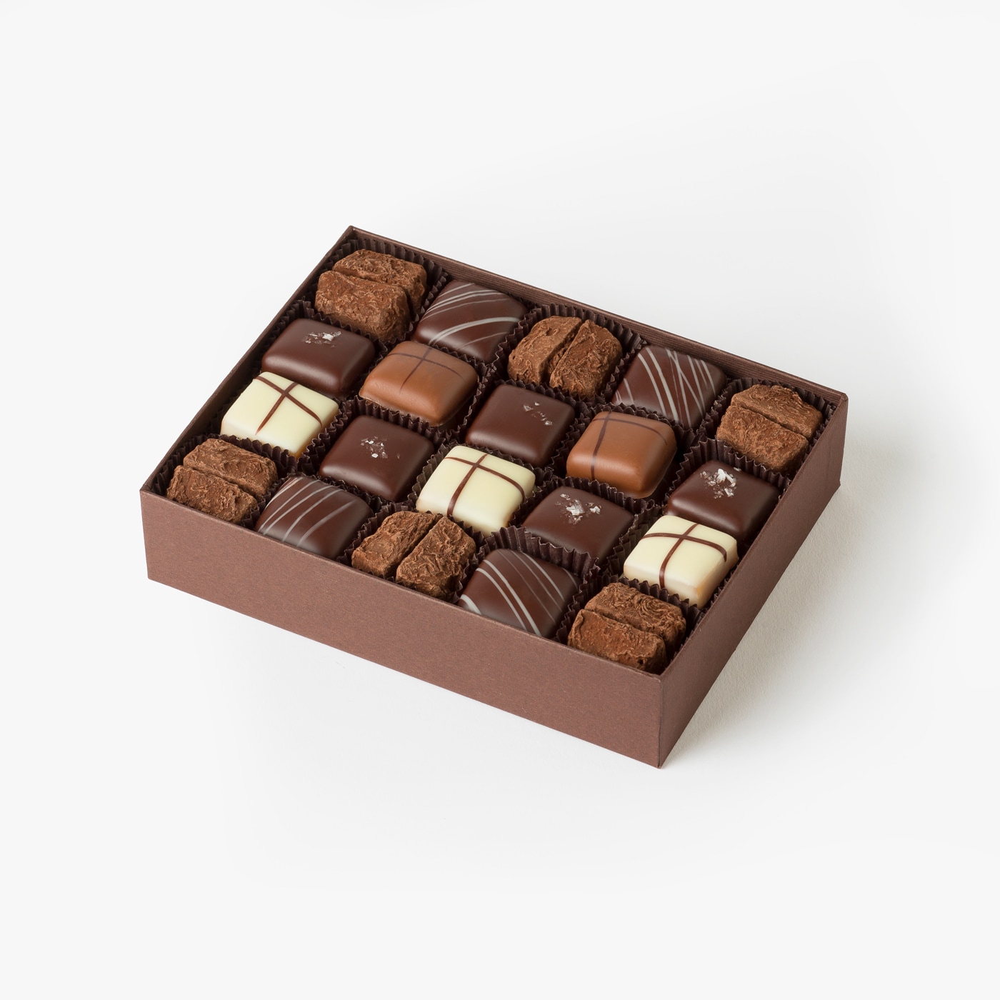 Assortment of chocolate covered caramels in a gift box